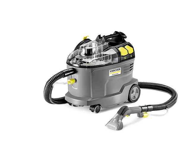 Een persoon boort met een gele accuboormachine